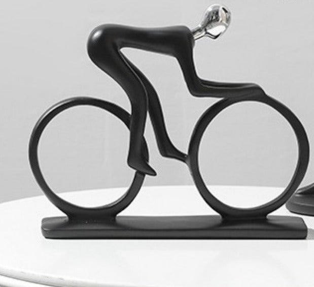 Man riding bicycle sports bike sculpture