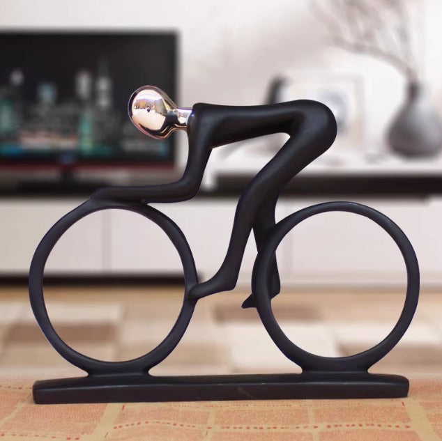 Man riding bicycle sports bike sculpture