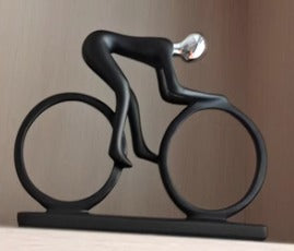 Man riding bicycle sports bike sculpture