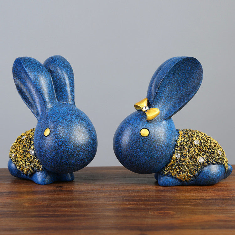 Twin blue rabbit sculpture